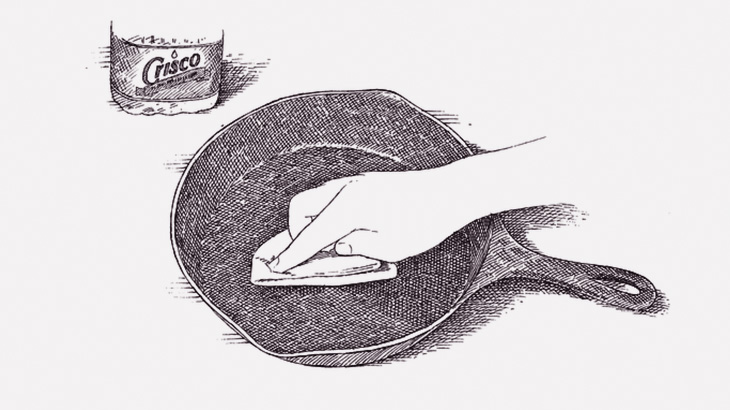 汚くなった鉄板を綺麗に掃除する、お店で働く男のルーティンワーク